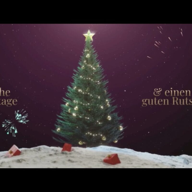 Weihnachtsbaum mit Text: "Schöne Feiertage und guten Rutsch!"
